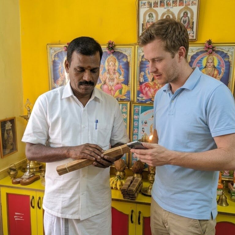 German seeker experiencing authentic Nadi palm leaf reading in Tamil Nadu, India. Discover how ancient palm leaves reveal precise details about past, present and future with remarkable accuracy.